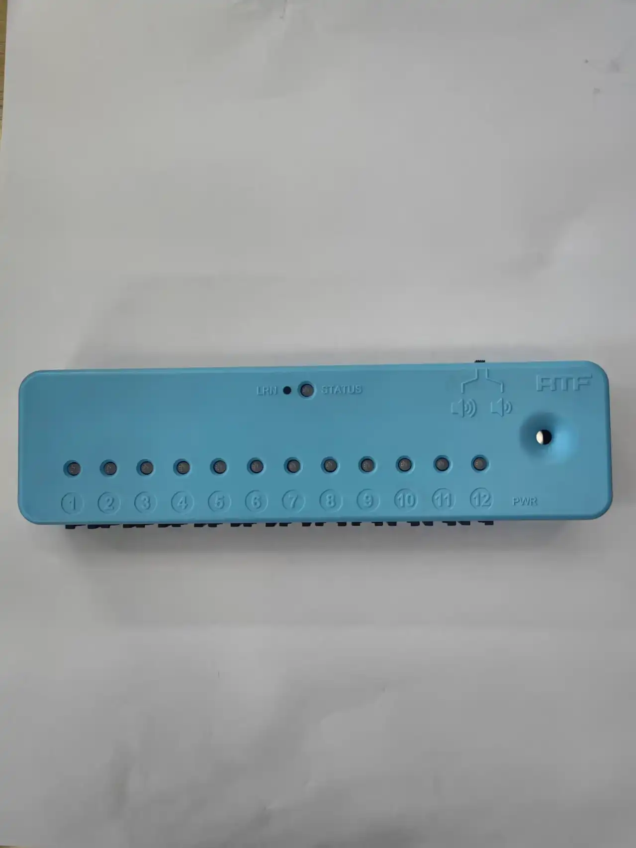 What are the key features of a twelve-way alarm control box?